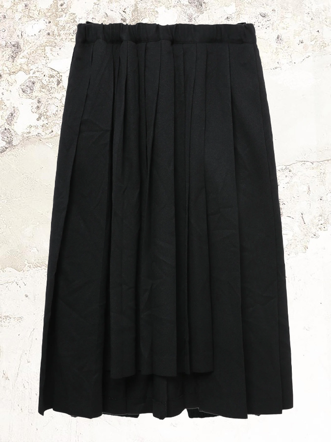 Black Comme Des Garçons pleated midi skirt