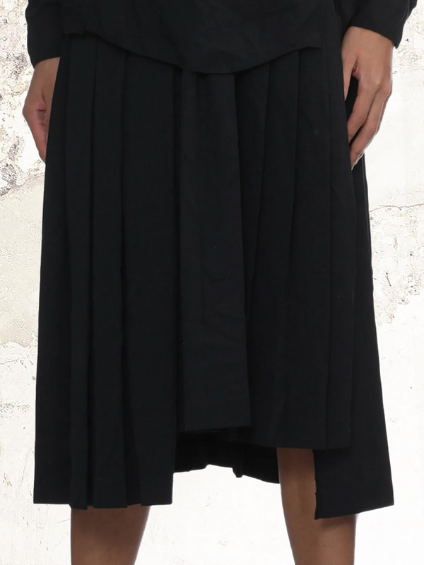 Black Comme Des Garçons pleated midi skirt