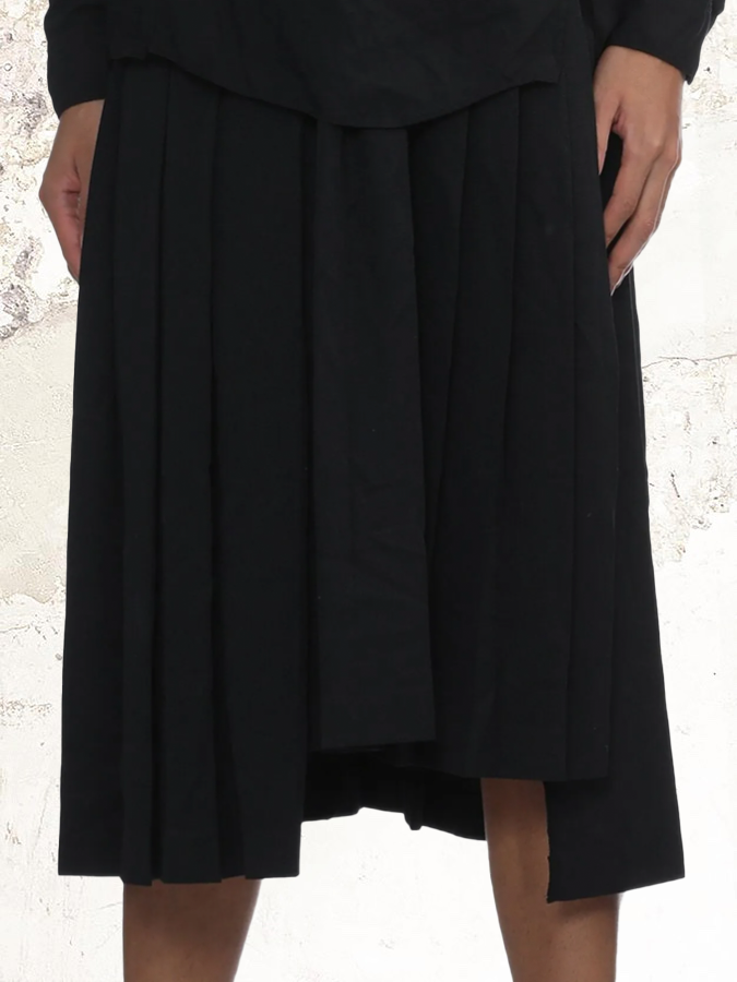Black Comme Des Garçons pleated midi skirt